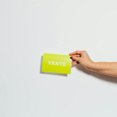 Hand Holding Green Business Card