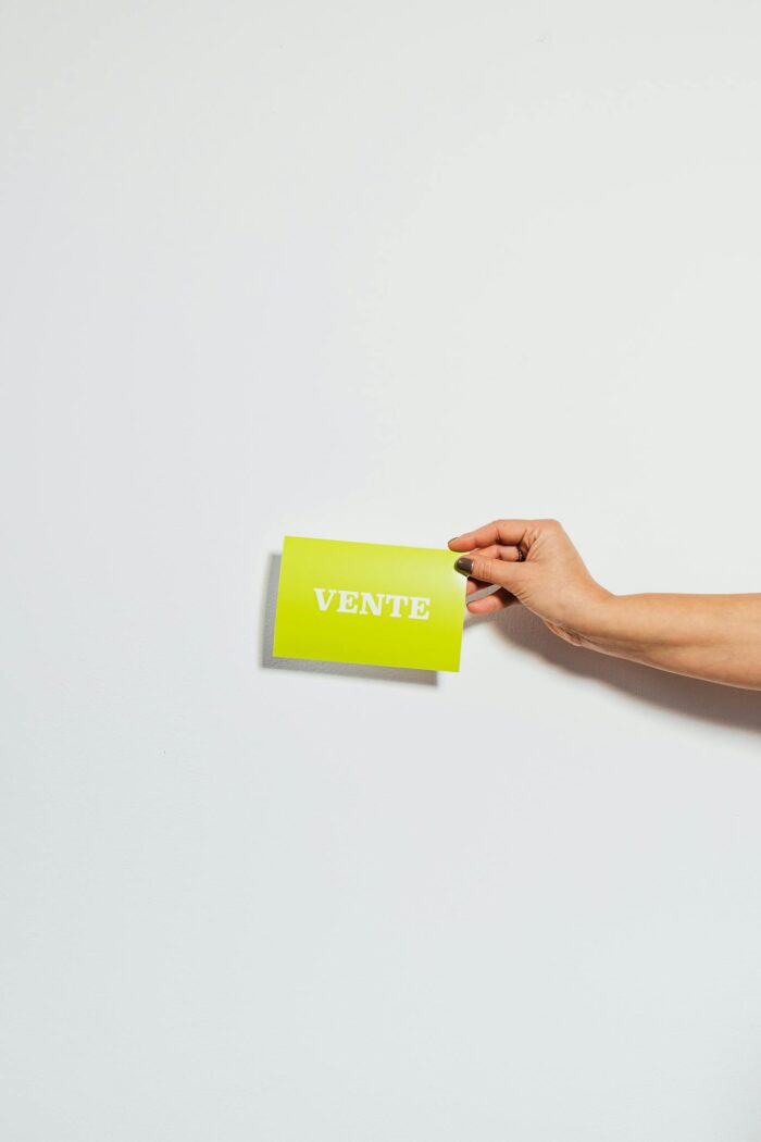 Hand Holding Green Business Card